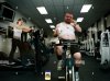 shocked-woman-looking-at-fat-man-eating-donut-while-exercising-in-gym-TTHG3N.jpg